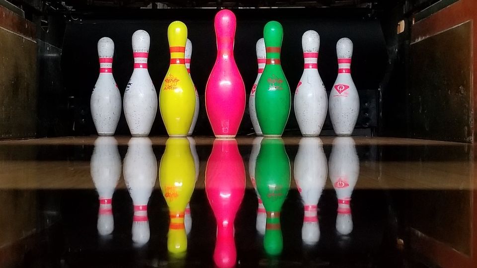 The Jackpot Shot: pink, yellow and green pins in the rack at Moonlight Jackpot Bowling